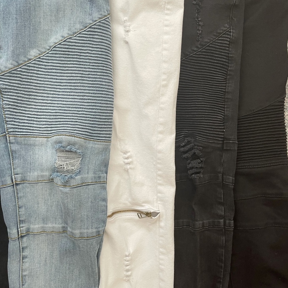 4 pairs of jeans being sold together.